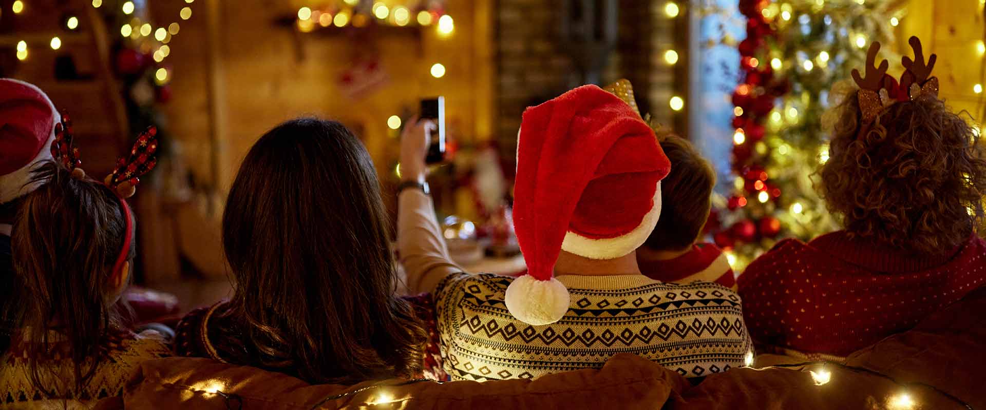 group of people watching a movie at christmas